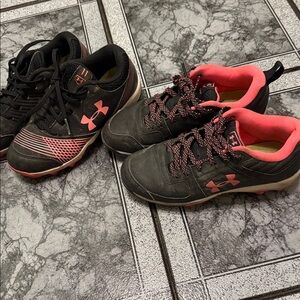 2 pair of Under Armour Black and Pink cleats (softball) size 1